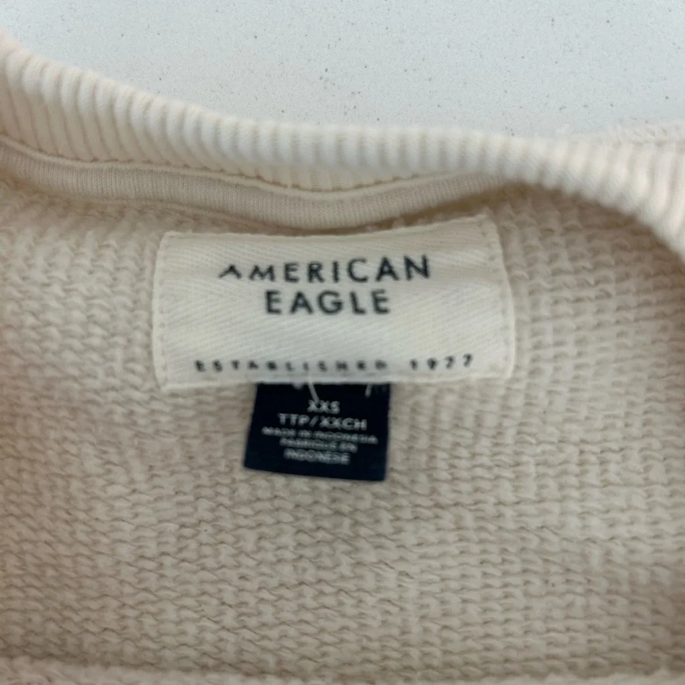 American Eagle Outfitters Cream Grinch Crew - Picture 3 of 3